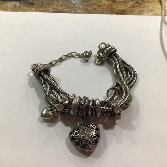 Silvertone bracelet. This bracelet has a lot going on. - Picture 3 of 4
